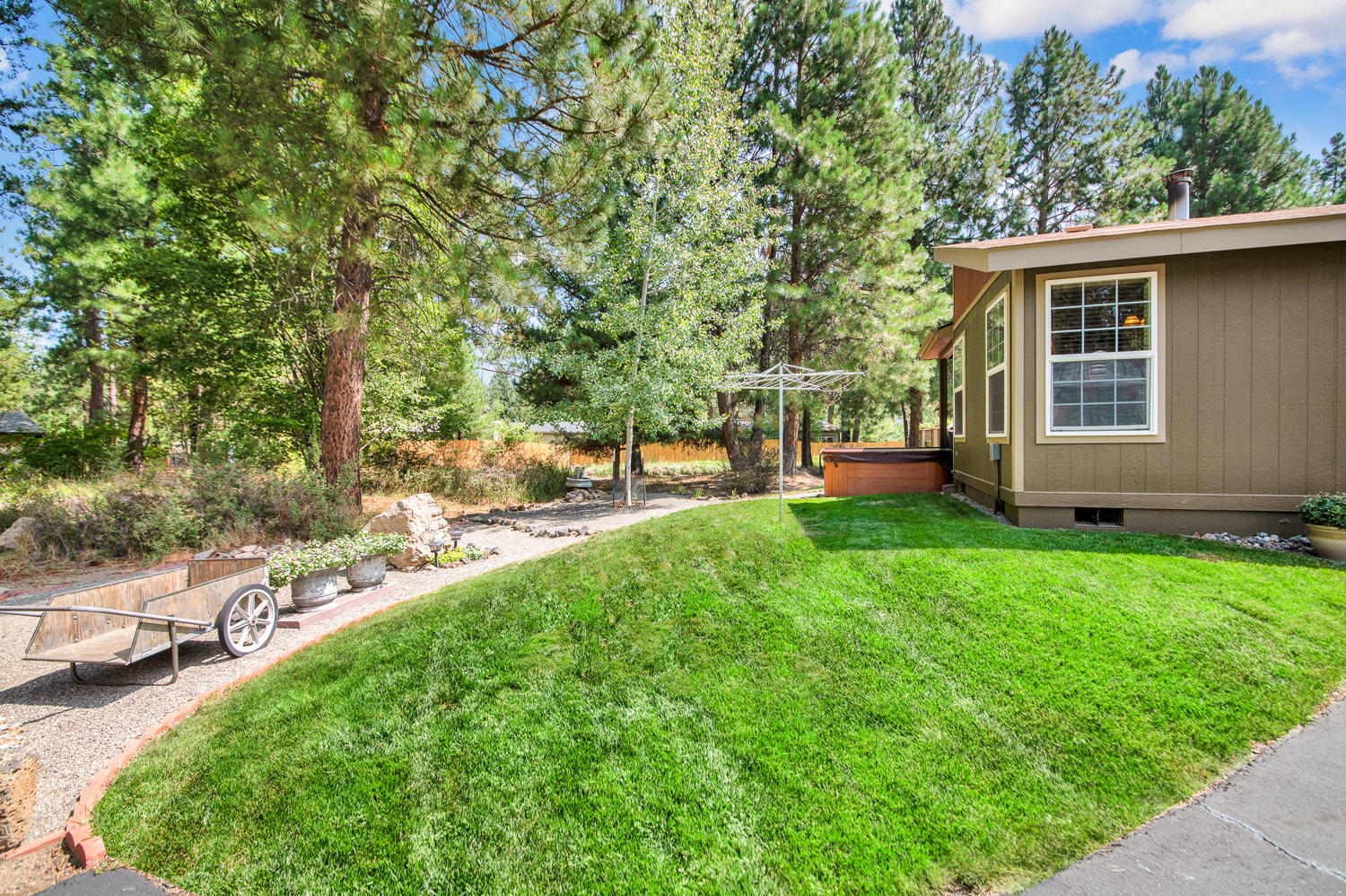 19166 Choctaw Road Bend, OR 97702 - Photo 7 of 23 a view of a house with backyard and sitting area