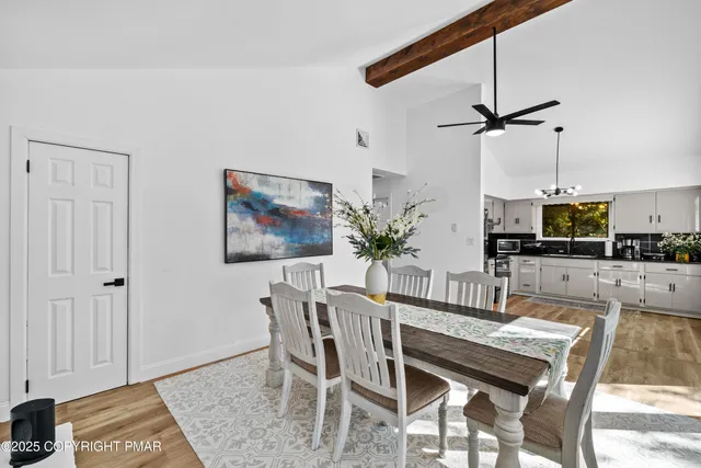 a dining room with furniture and window