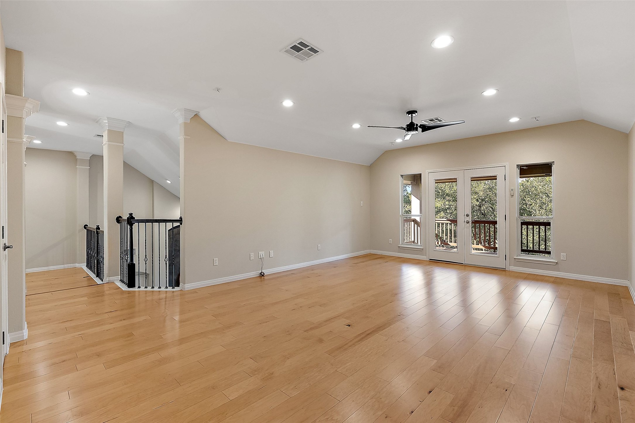 8215 Dark Ridge Cove Austin, TX 78737 - Photo 24 of 40 The second floor centers around a spacious family room with warm wood flooring and direct outdoor deck access for daily enjoyment.