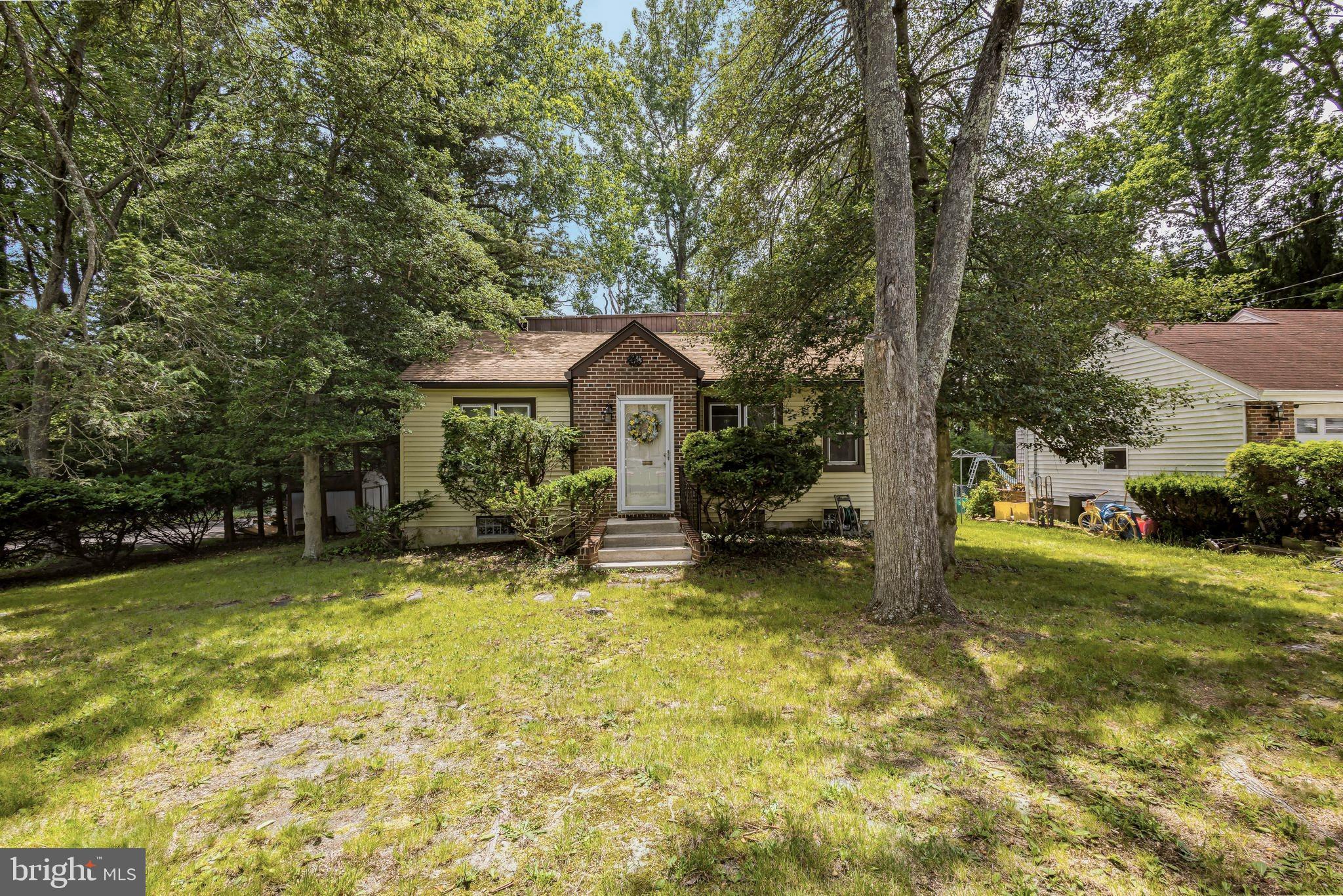 41 Spring Lake Drive Clementon, NJ 08021 - Photo 5 of 30 a view of house with outdoor seating and covered with trees