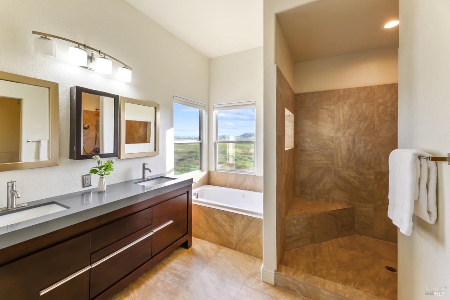 9 Regatta Way Napa, CA 94559 - Photo 11 of 20 a spacious bathroom with a granite countertop sink mirror and bathtub
