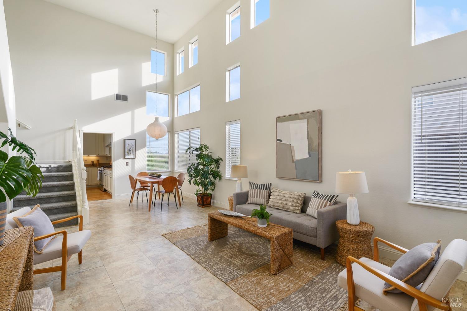 9 Regatta Way Napa, CA 94559 - Photo 2 of 20 a living room with furniture a rug and a lamp