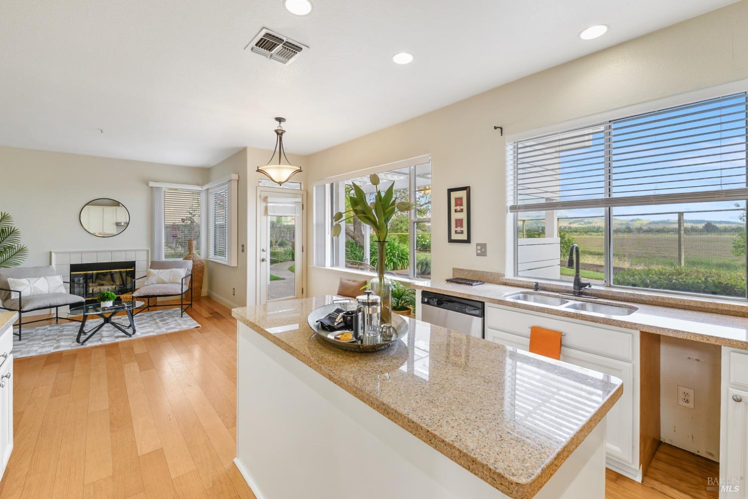 9 Regatta Way Napa, CA 94559 - Photo 7 of 20 a kitchen with sink refrigerator dining table and chairs