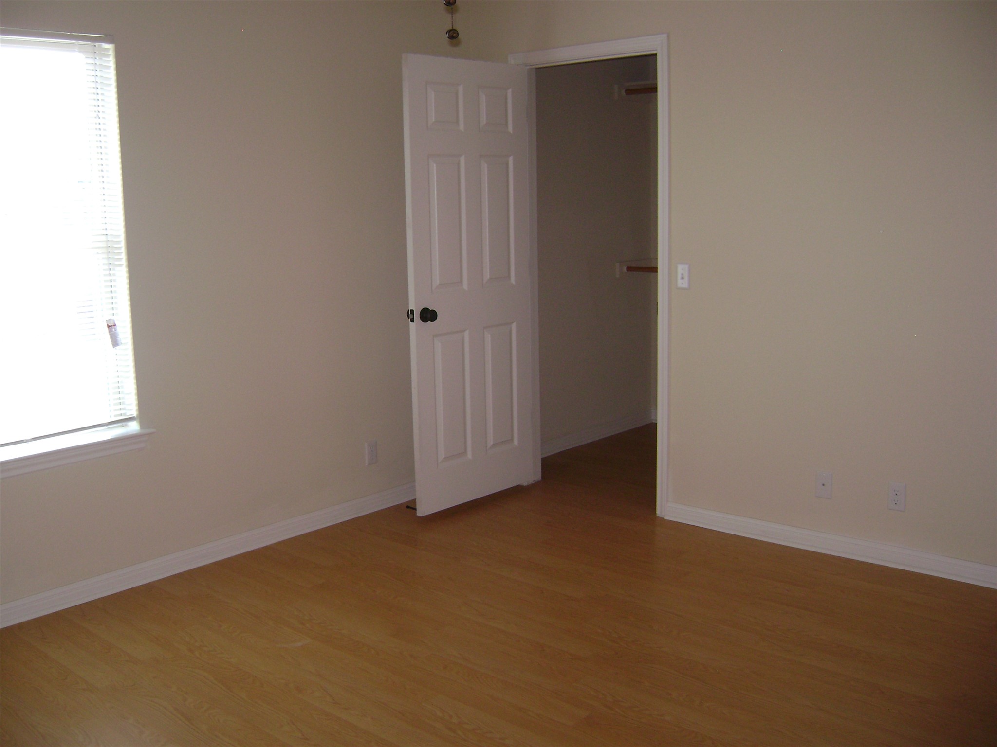 2507 Oak Lane, Unit A Georgetown, TX 78628 - Photo 9 of 11 A well-lit room showcases rich hardwood flooring and a convenient walk-in closet.
