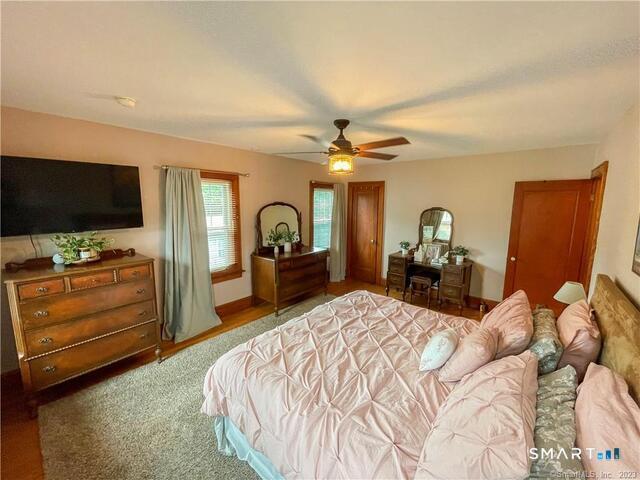 16 Meriden Avenue Meriden, CT 06451 - Photo 13 of 29 a bedroom with a bed and a flat tv screen on dresser