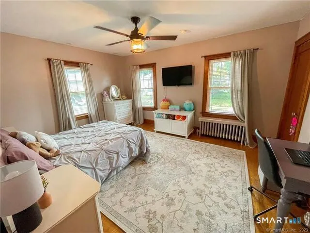 a bedroom with a bed and a dresser