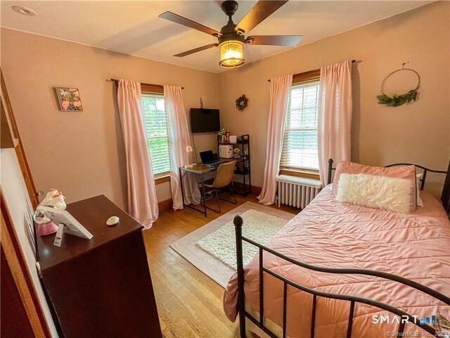 16 Meriden Avenue Meriden, CT 06451 - Photo 17 of 29 a bedroom with a bed and a chandelier