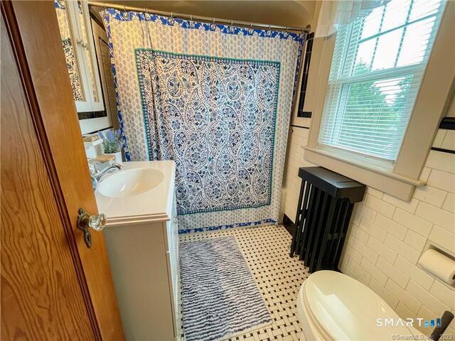 16 Meriden Avenue Meriden, CT 06451 - Photo 20 of 29 a bathroom with a sink toilet and shower