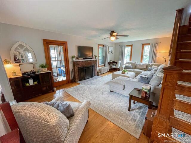 16 Meriden Avenue Meriden, CT 06451 - Photo 2 of 29 a living room with furniture fireplace and a flat screen tv