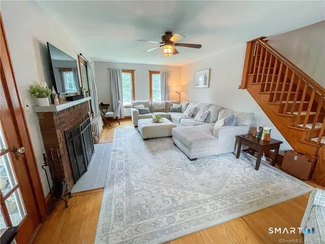 a living room with furniture and a flat screen tv