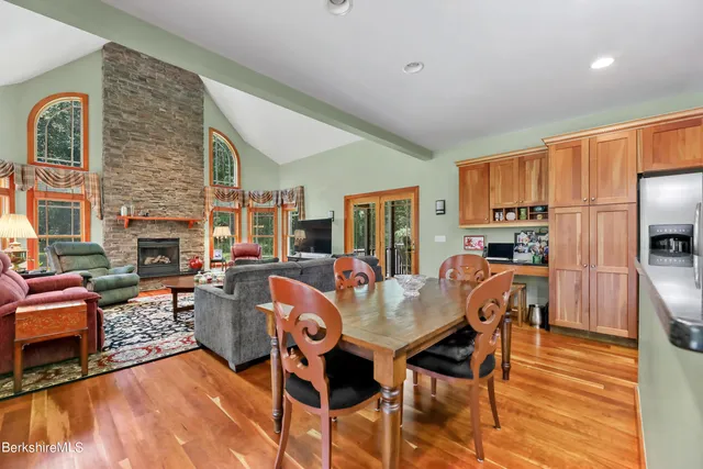 a bedroom with furniture and large windows