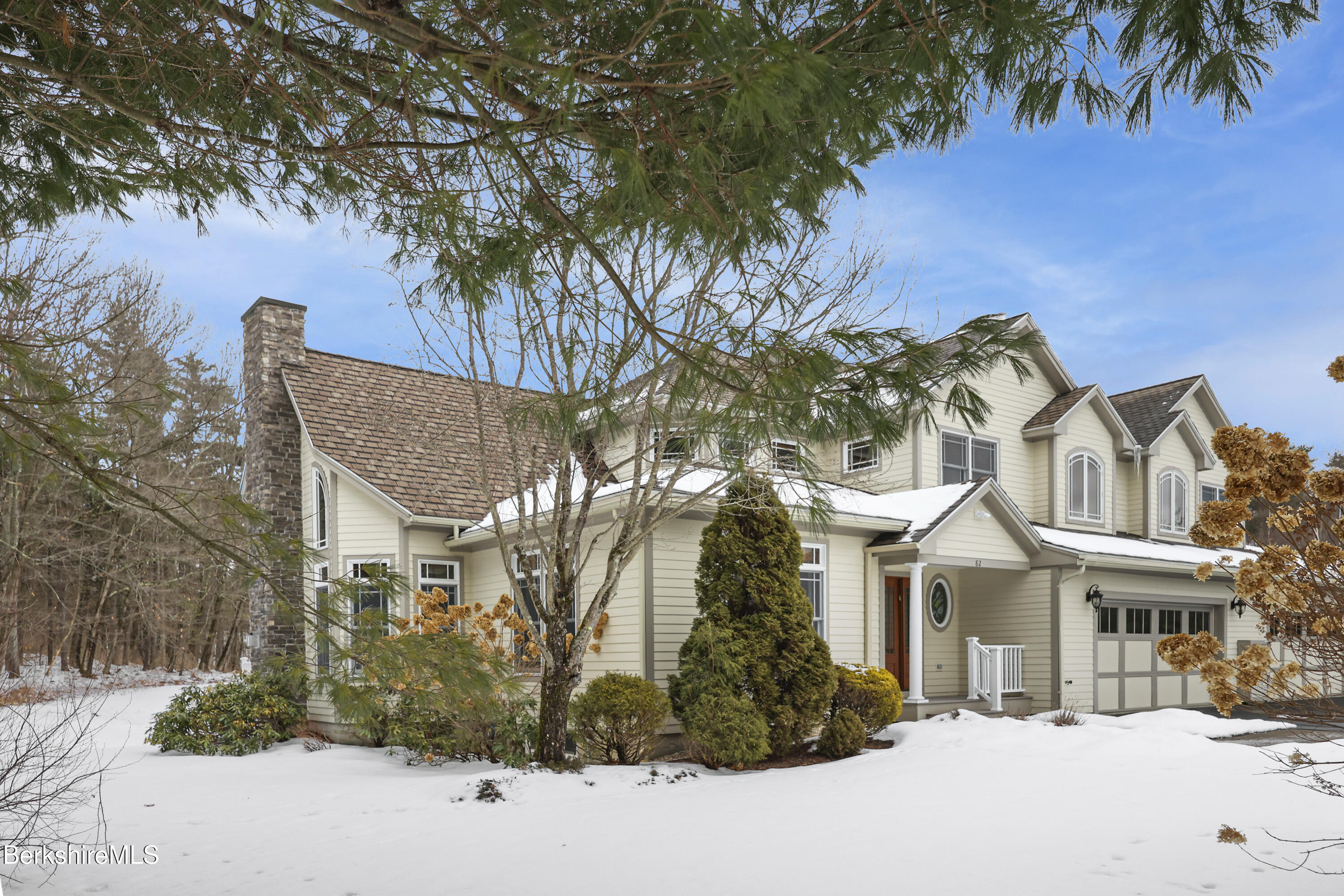 82 Stockbridge Terrace, Unit 82 Lee, MA 01238 - Photo 2 of 64 a front view of a house with a tree