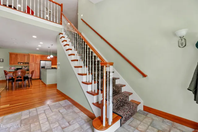 a bedroom with furniture and a flat screen tv