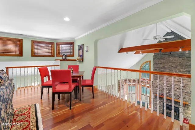 a spacious bathroom with a granite countertop sink and a mirror