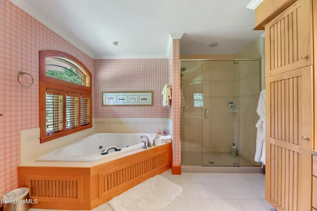 a living room with furniture a table and kitchen view