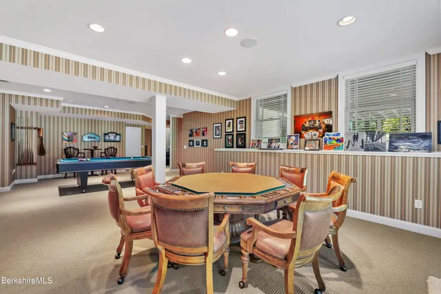 a aerial view of a house with a yard and potted plants