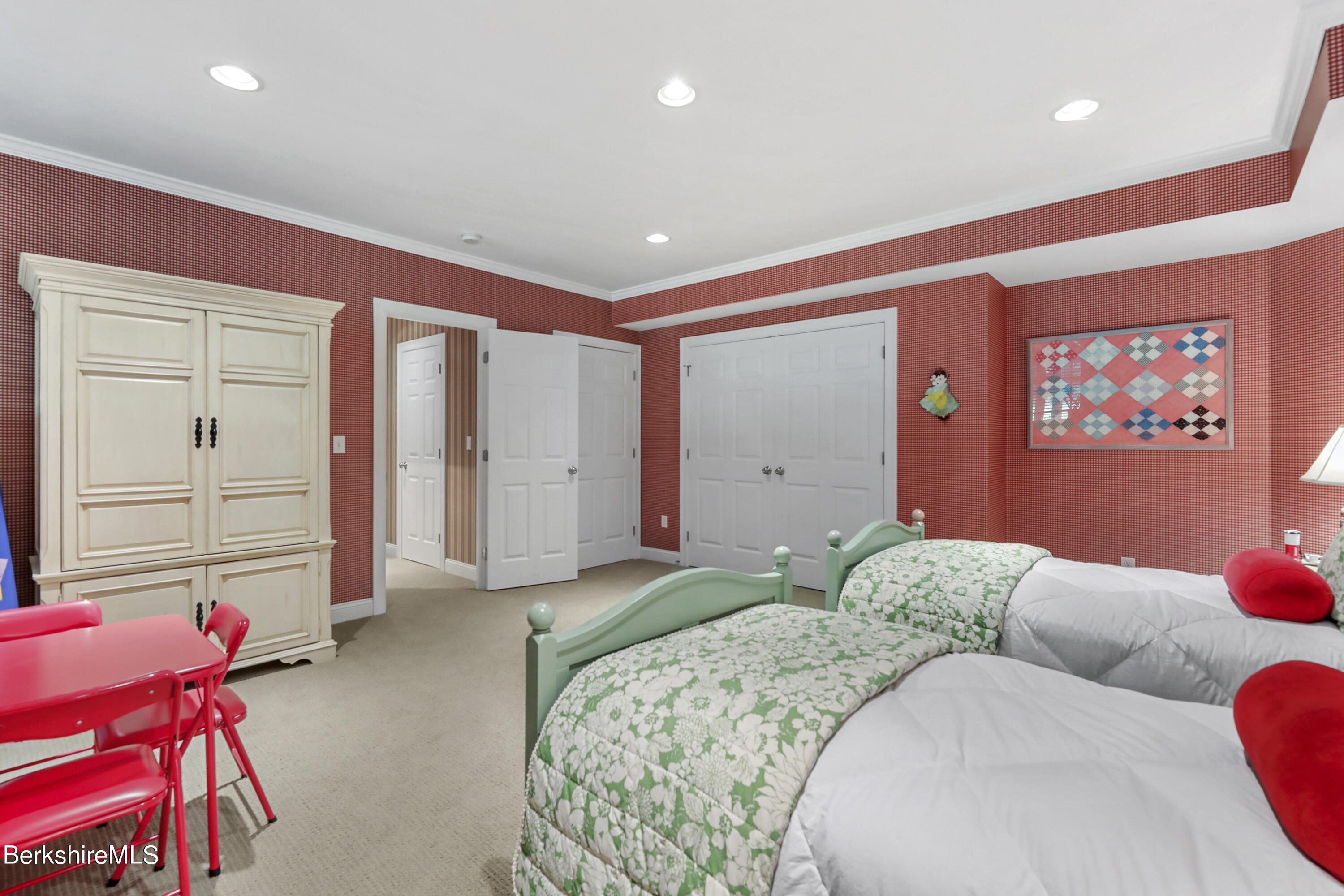 82 Stockbridge Terrace, Unit 82 Lee, MA 01238 - Photo 44 of 64 a bedroom with a bed and closet with mirror