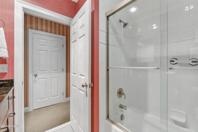 an aerial view of a house with swimming pool and garden