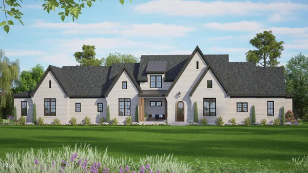 a view of a house with a yard and a large tree in front of it