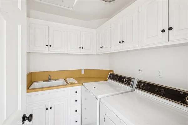 a bathroom with a sink and mirror with toilet