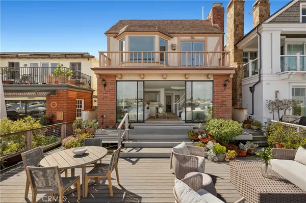 a view of a building with a dining table and chairs