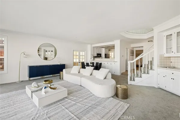 a living room with furniture a fireplace and a table