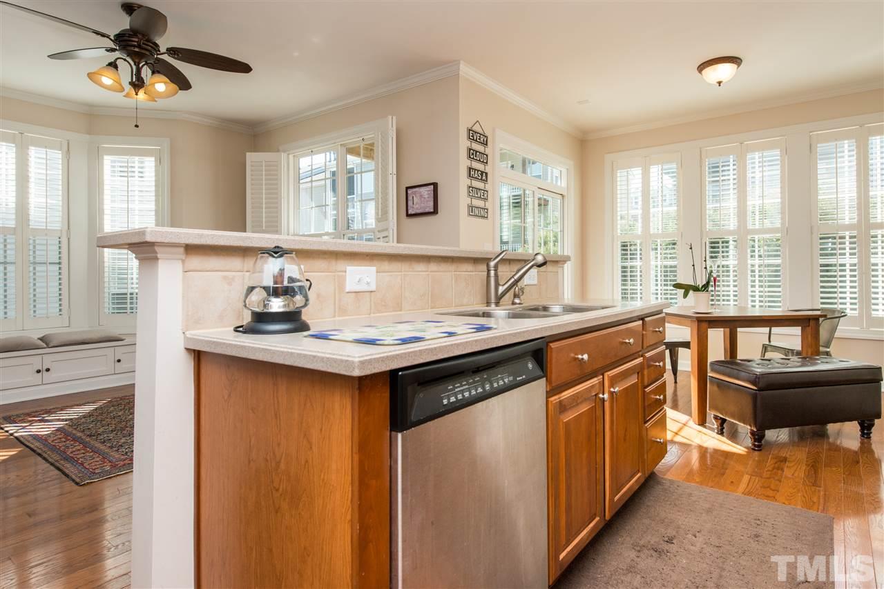 3517 Edgemont Drive Raleigh, NC 27612 - Photo 11 of 25 a kitchen with a sink stove and cabinets