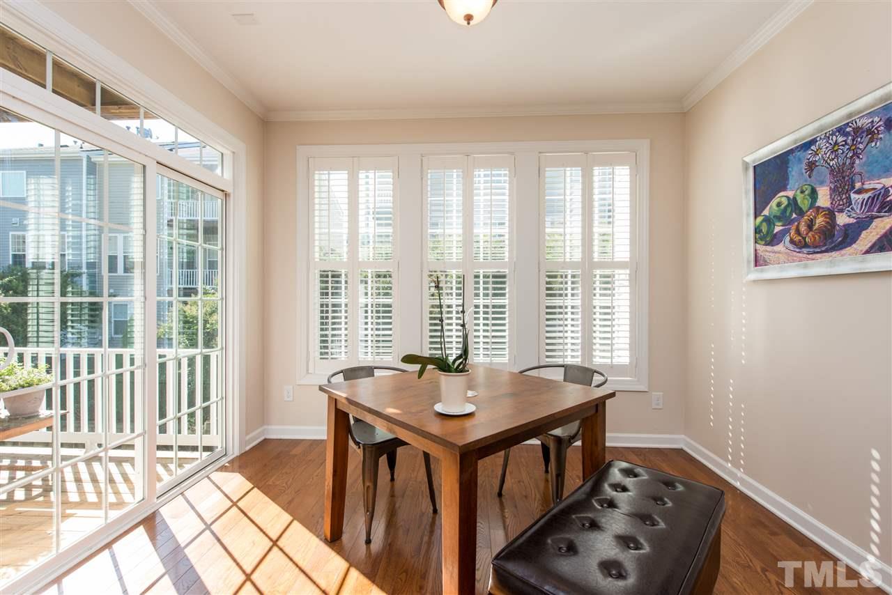 3517 Edgemont Drive Raleigh, NC 27612 - Photo 12 of 25 a bedroom with a bed and a table