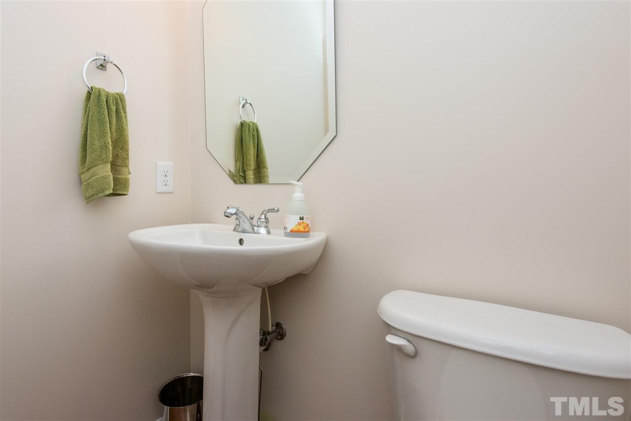 3517 Edgemont Drive Raleigh, NC 27612 - Photo 15 of 25 a bathroom with a toilet sink and mirror