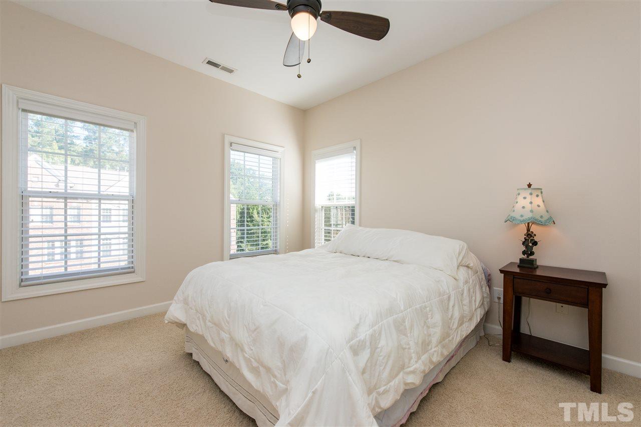 3517 Edgemont Drive Raleigh, NC 27612 - Photo 19 of 25 a bedroom with a bed and a window