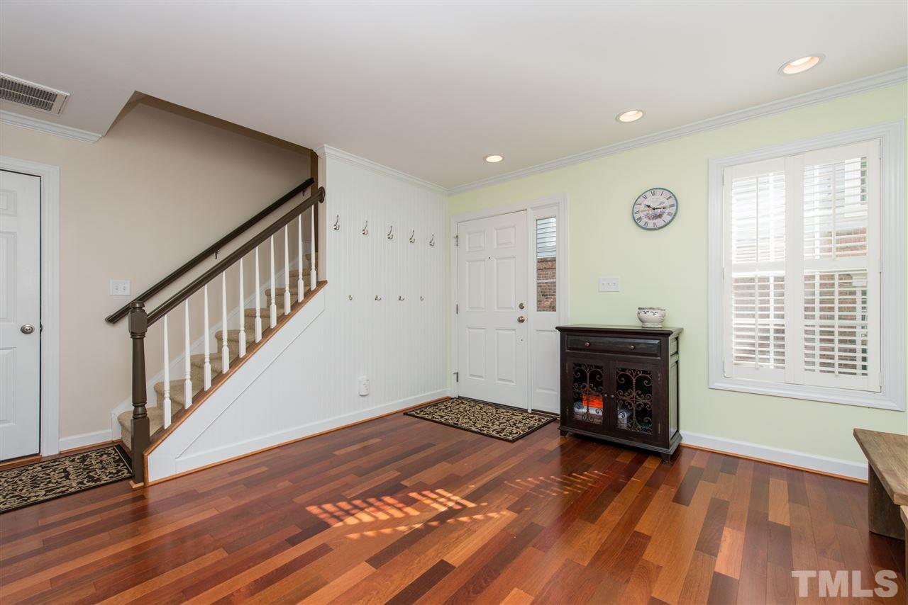 3517 Edgemont Drive Raleigh, NC 27612 - Photo 3 of 25 a view of empty room with fireplace and wooden floor