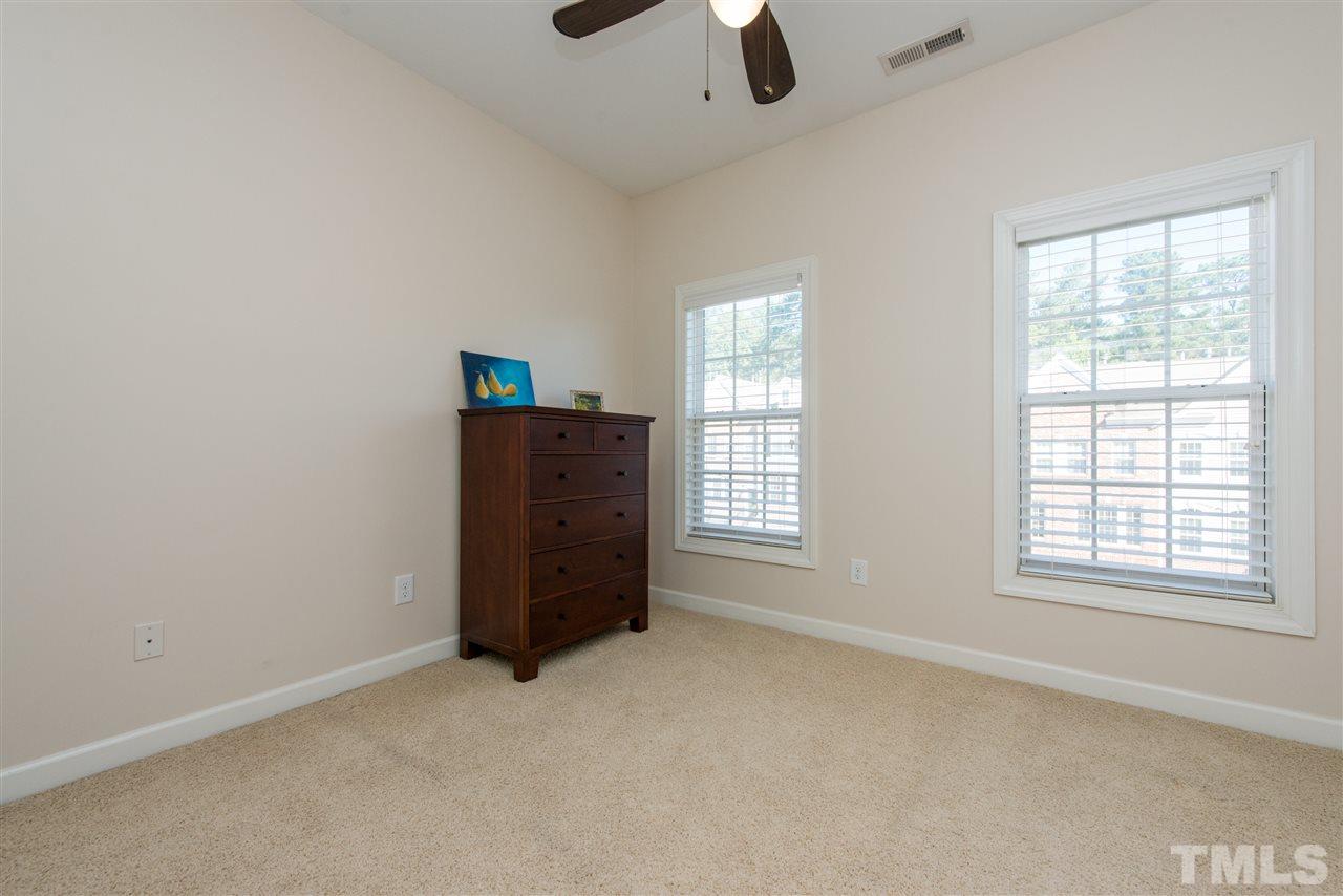 3517 Edgemont Drive Raleigh, NC 27612 - Photo 21 of 25 an empty room with a empty space and windows