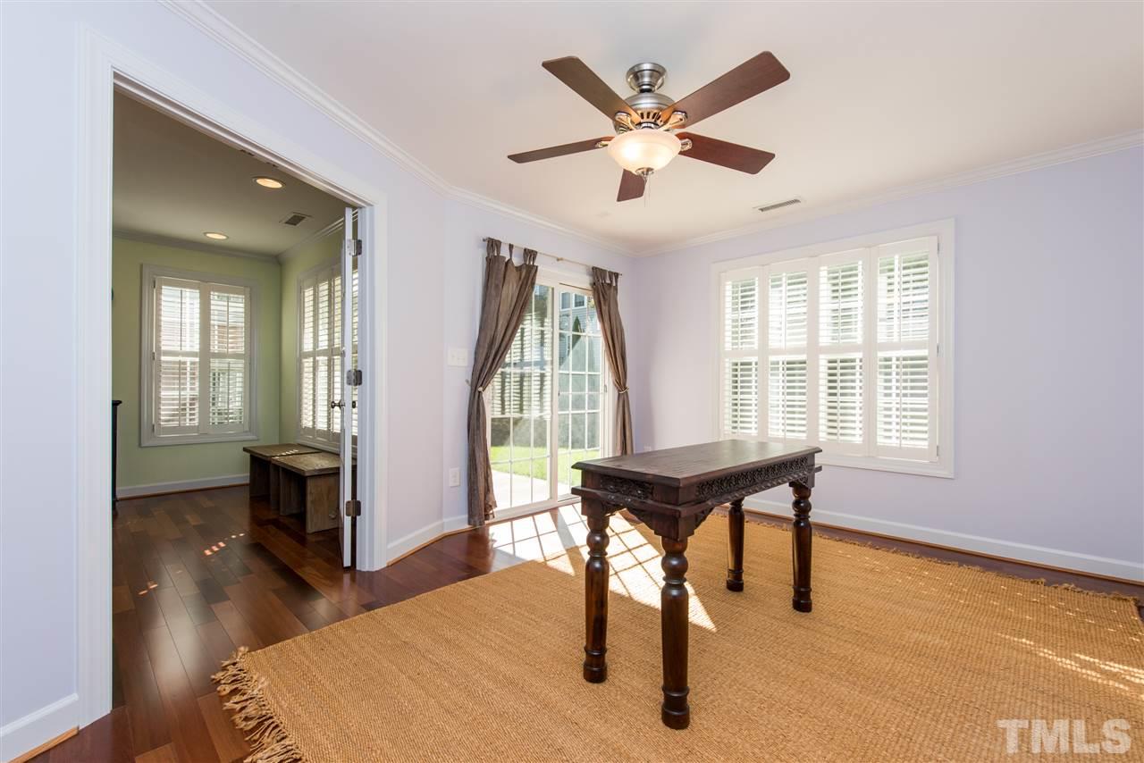 3517 Edgemont Drive Raleigh, NC 27612 - Photo 4 of 25 a dining room with wooden floor and a window