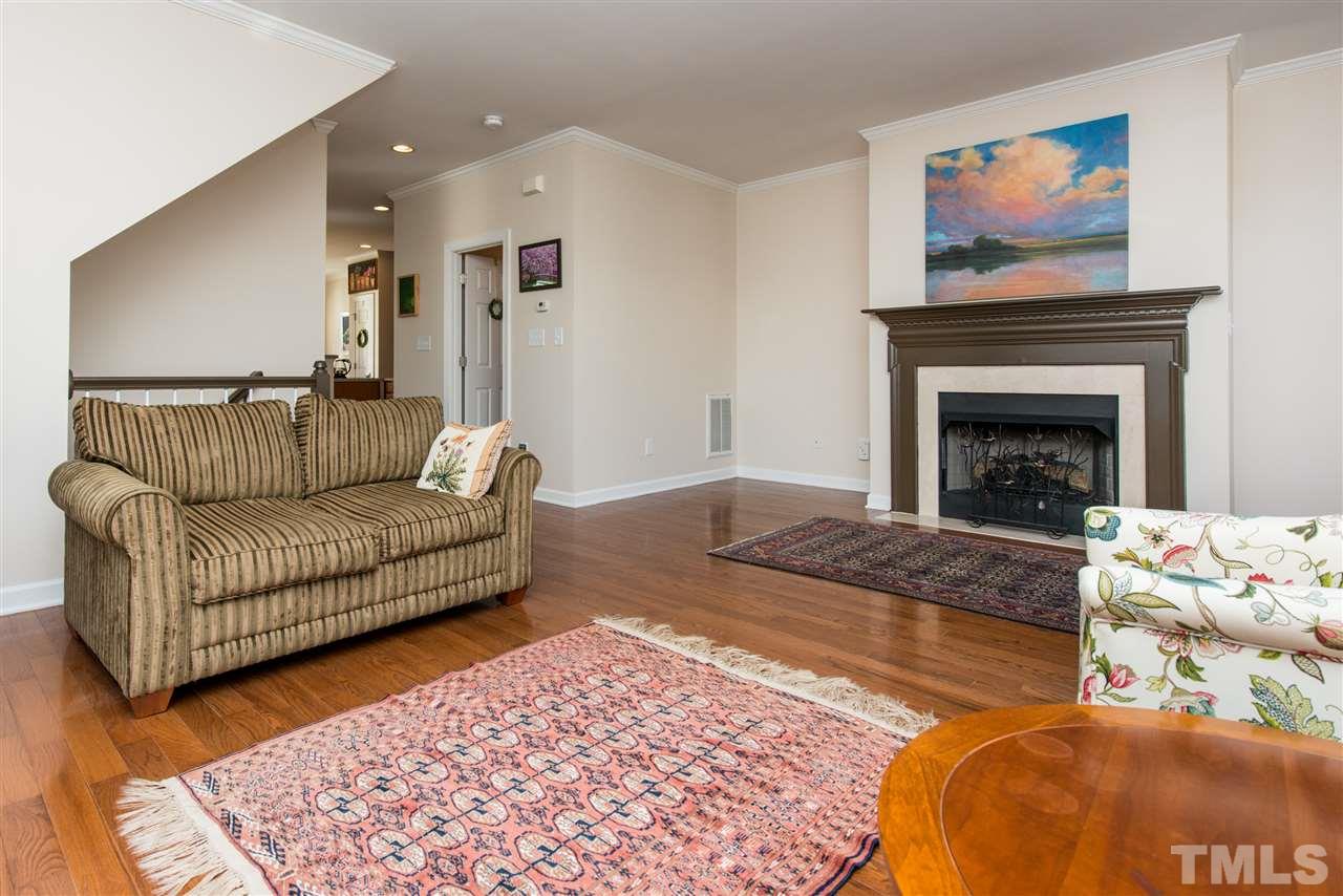 3517 Edgemont Drive Raleigh, NC 27612 - Photo 6 of 25 a living room with furniture and a fireplace