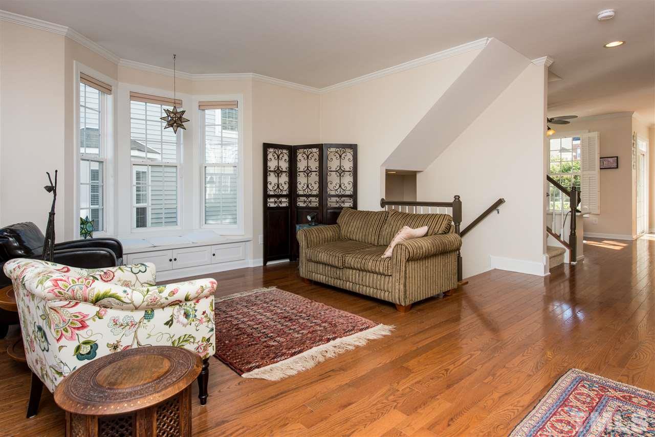 3517 Edgemont Drive Raleigh, NC 27612 - Photo 8 of 25 a living room with furniture and a large window