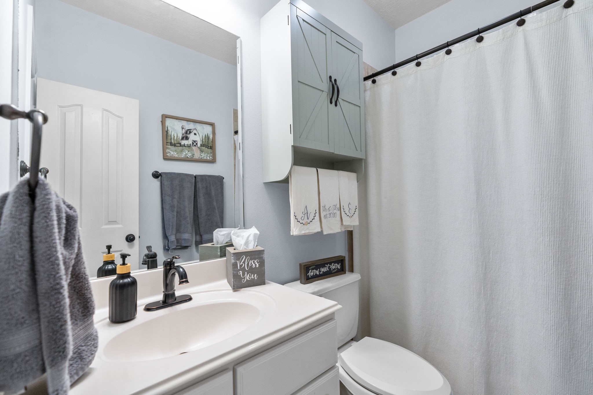 5942 Wildflower Road Sealy, TX 77474 - Photo 20 of 41 a bathroom with a sink toilet and shower