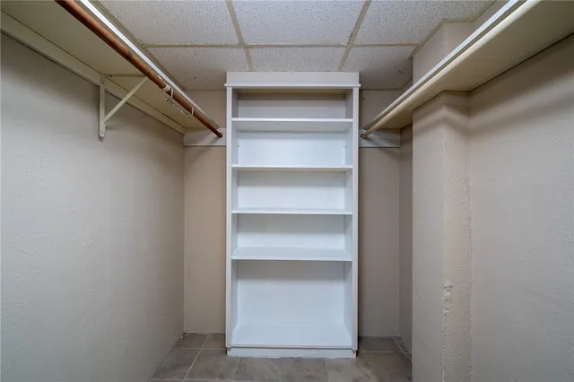 a view of an empty walk in closet