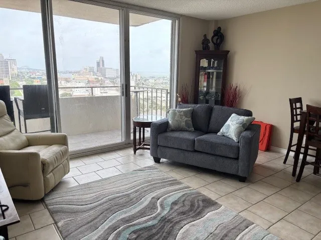a living room with furniture and a large window