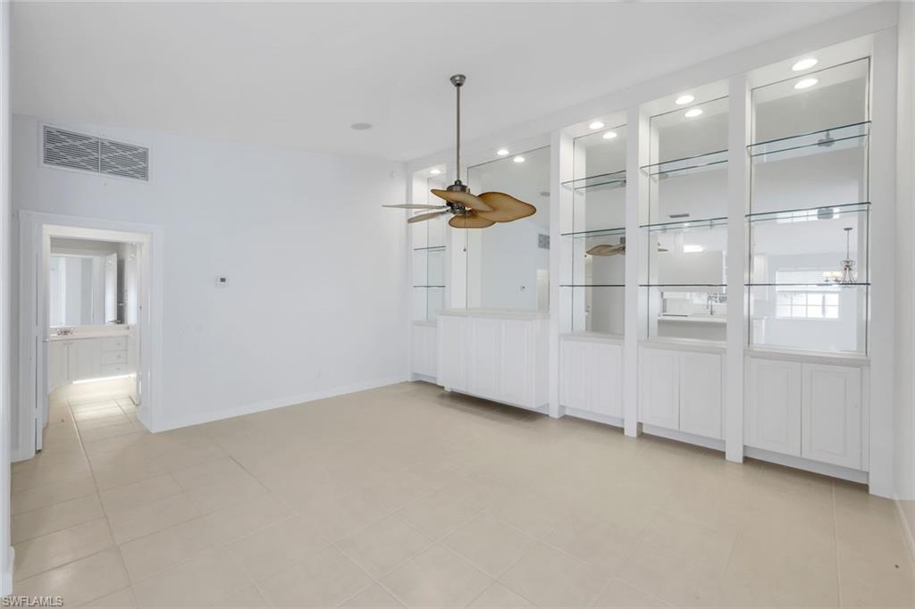 3748 Exuma Way Naples, FL 34119 - Photo 31 of 50 Den or dinning room featuring a ceiling fan and recessed lighting. Built in cabinets.