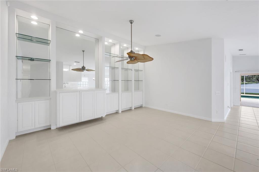 3748 Exuma Way Naples, FL 34119 - Photo 34 of 50 Living room, den/ dining area with light tile patterned flooring, recessed lighting, and a ceiling fan.