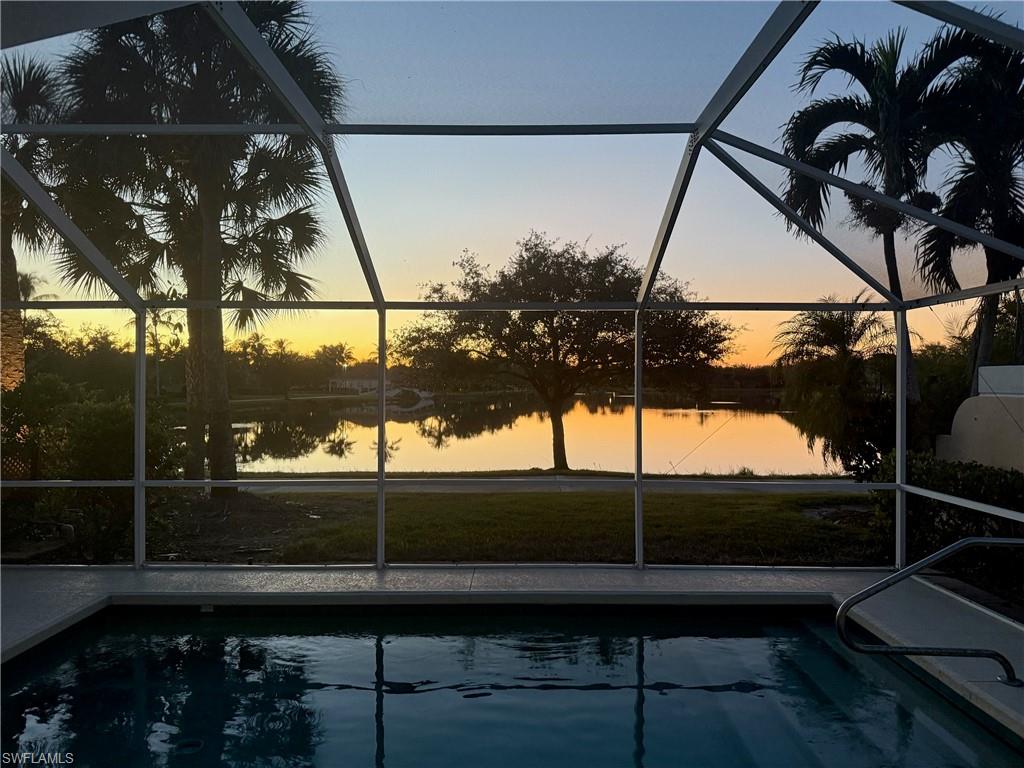 3748 Exuma Way Naples, FL 34119 - Photo 44 of 50 SUNSET relaxing in your pool looking at the beautiful lake and sky.