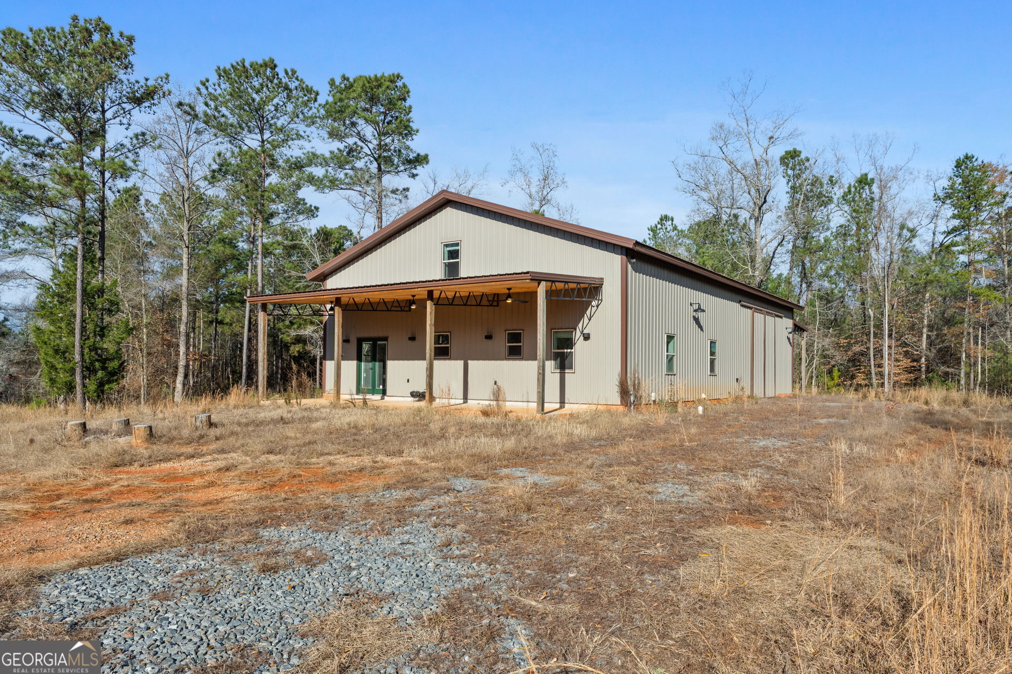 1140 City Pond Road Barnesville, GA 30204 - Photo 1 of 37 a front view of house with yard and trees in the background