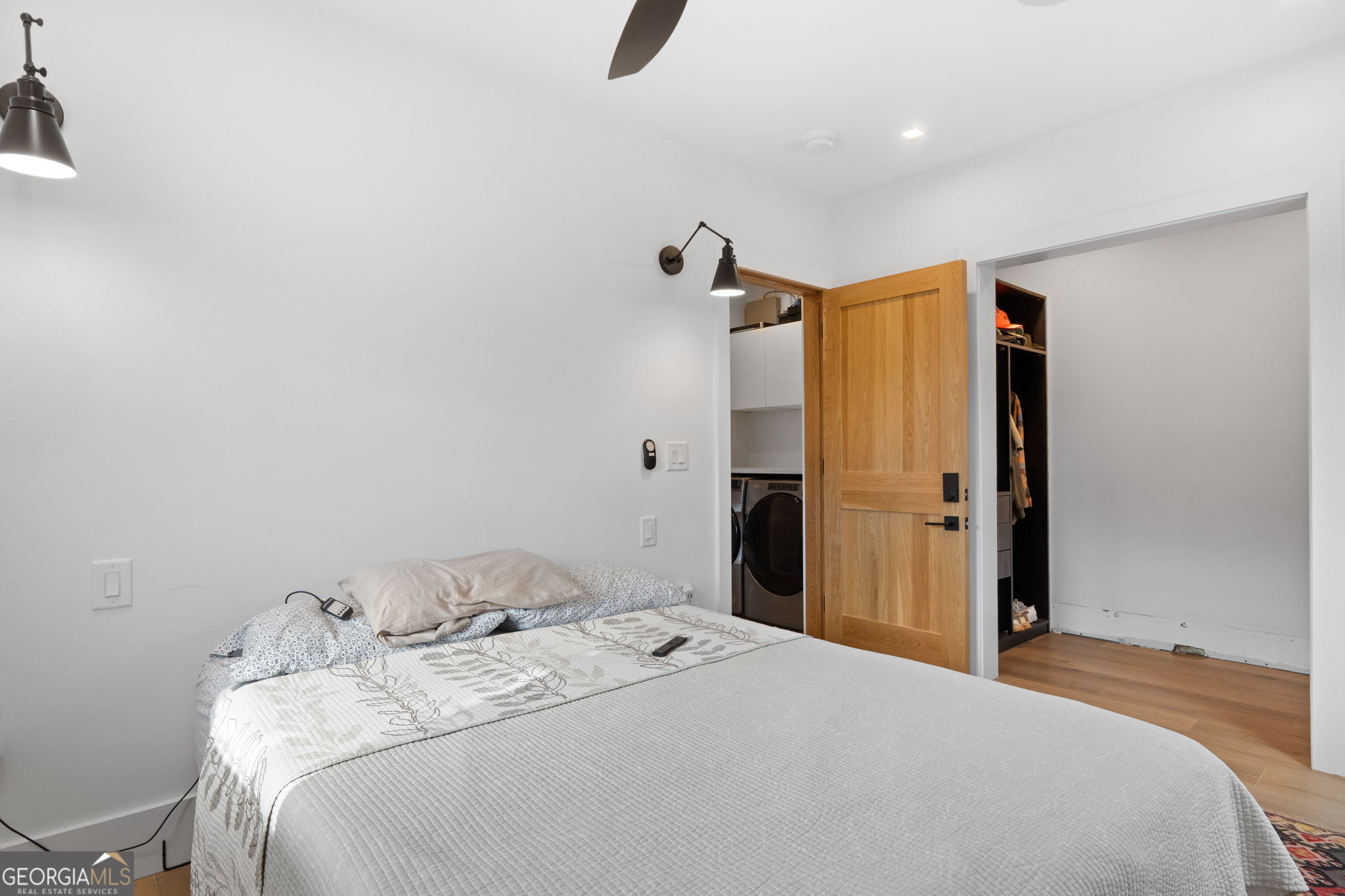 1140 City Pond Road Barnesville, GA 30204 - Photo 16 of 37 a bedroom with a bed and a chandelier