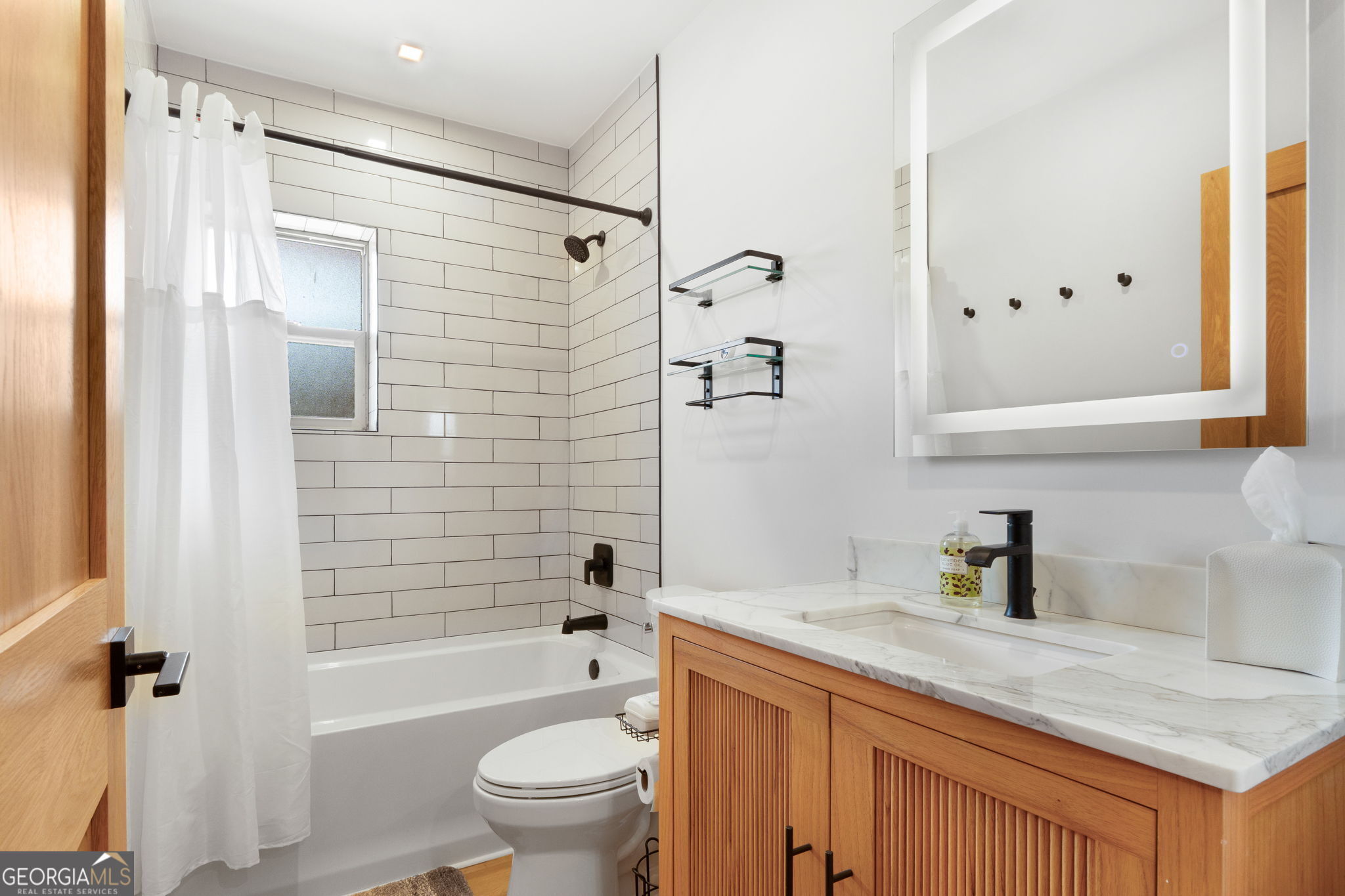 1140 City Pond Road Barnesville, GA 30204 - Photo 18 of 37 a bathroom with a granite countertop sink toilet and shower