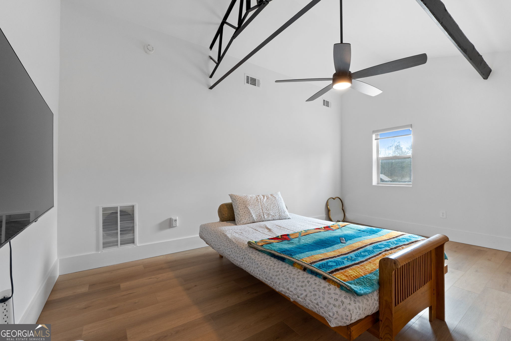 1140 City Pond Road Barnesville, GA 30204 - Photo 20 of 37 a bedroom with a bed table and a window