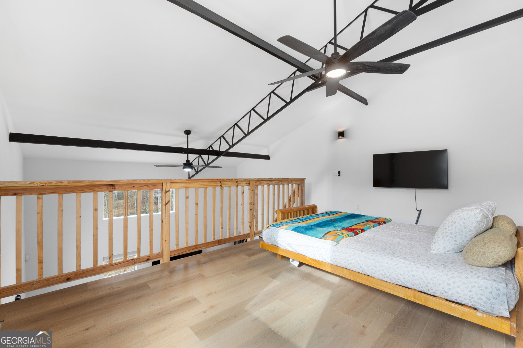 1140 City Pond Road Barnesville, GA 30204 - Photo 23 of 37 a bedroom with a bed and a table