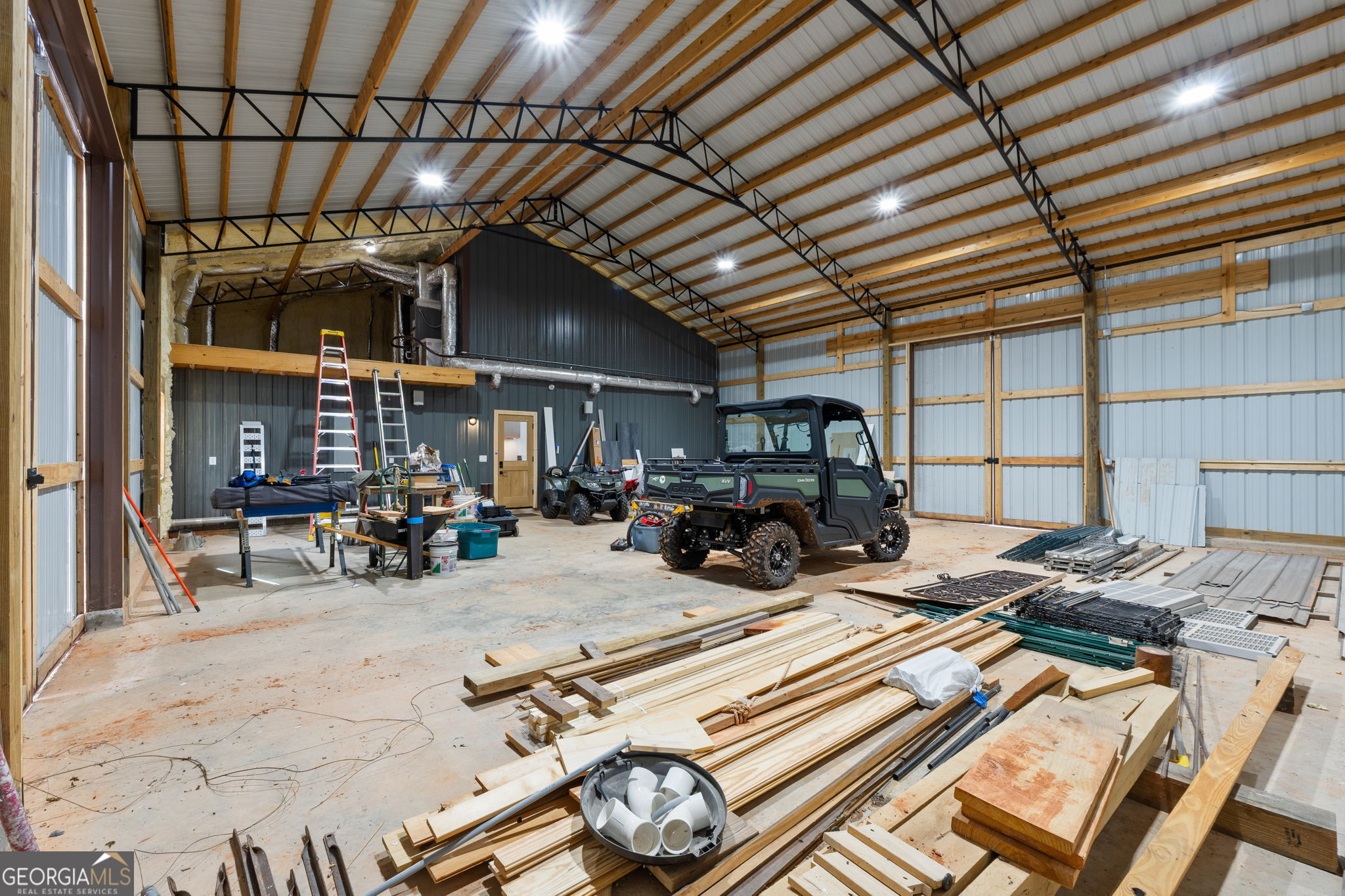 1140 City Pond Road Barnesville, GA 30204 - Photo 25 of 37 a view of a storage room with furniture
