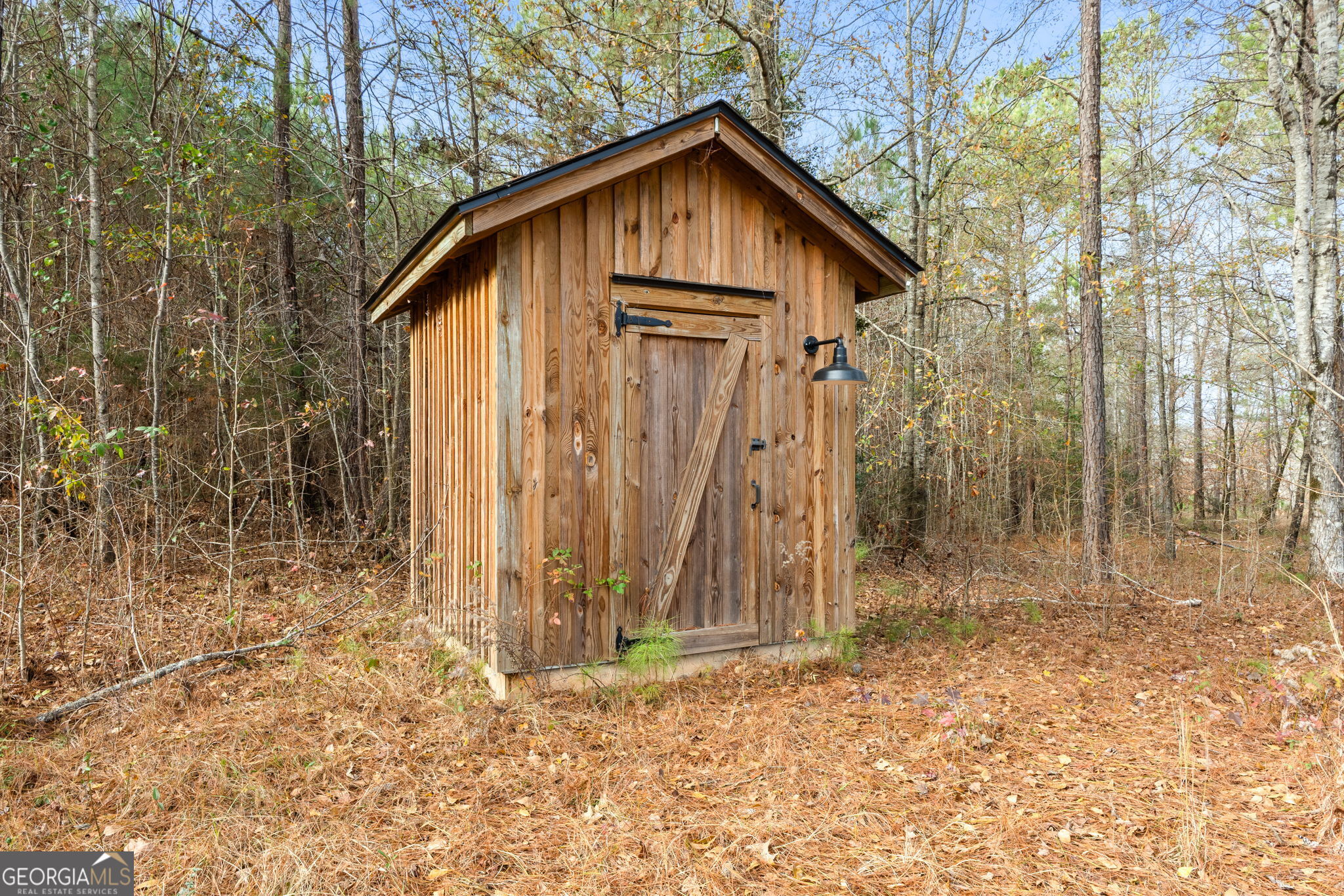 1140 City Pond Road Barnesville, GA 30204 - Photo 28 of 37 a house with trees in the background