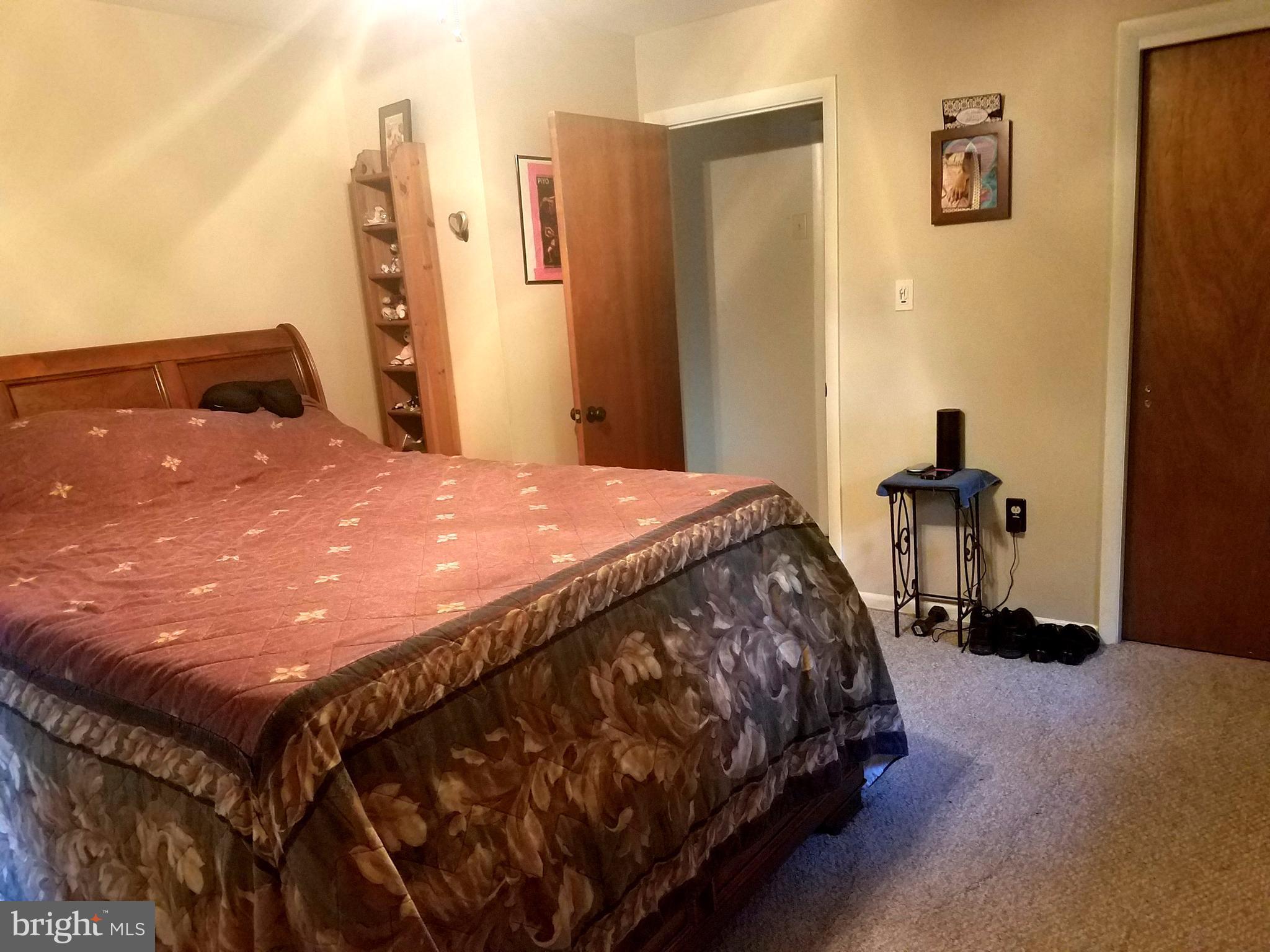 6901 Friendship Road Clinton, MD 20735 - Photo 13 of 26 a bedroom with a bed and dresser