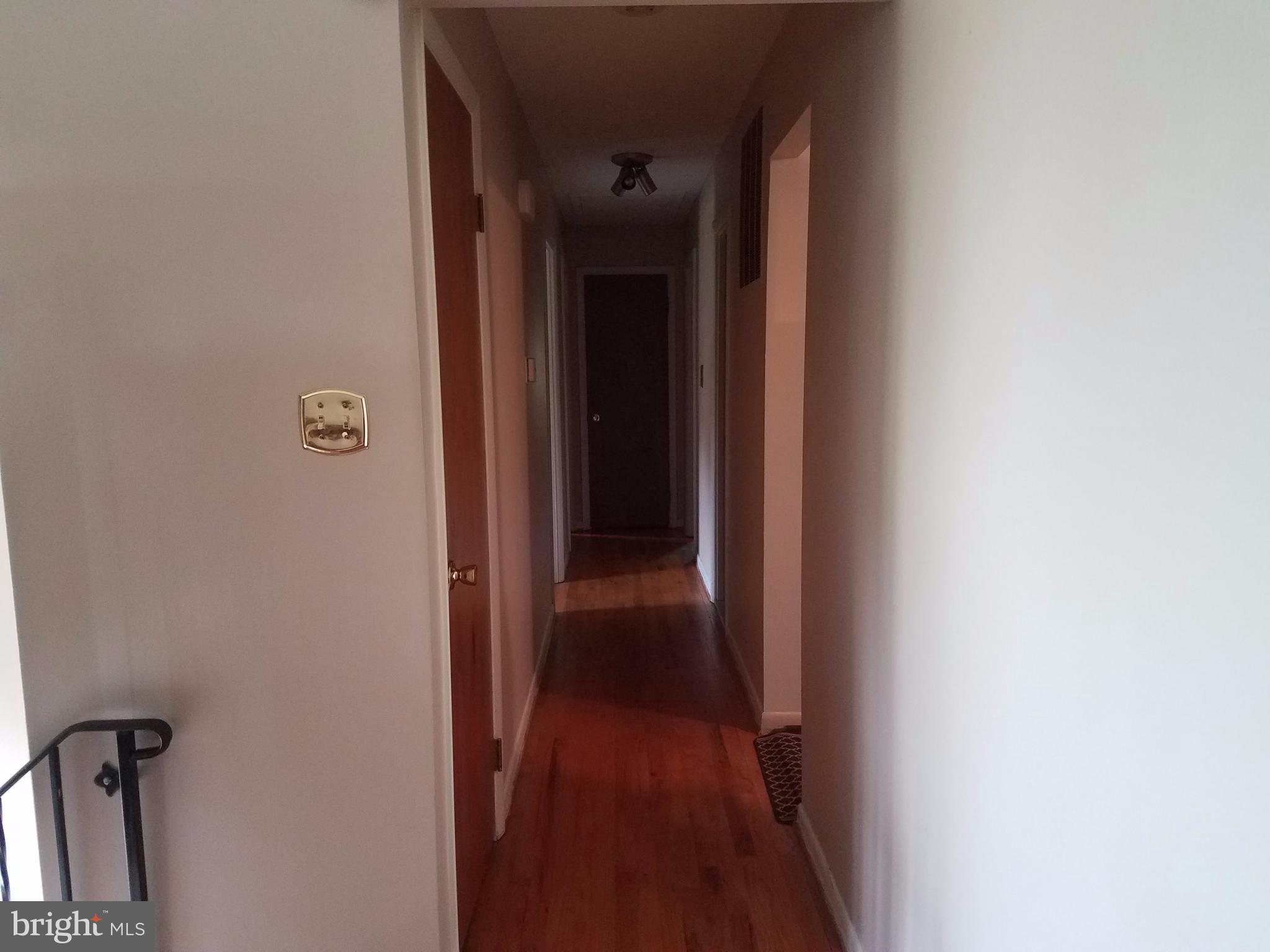 6901 Friendship Road Clinton, MD 20735 - Photo 20 of 26 a view of a hallway with wooden floor